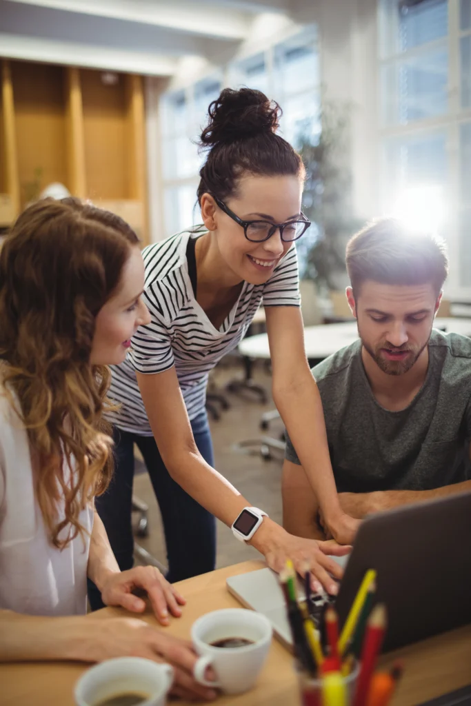 group-business-executives-discussing-laptop-their-des